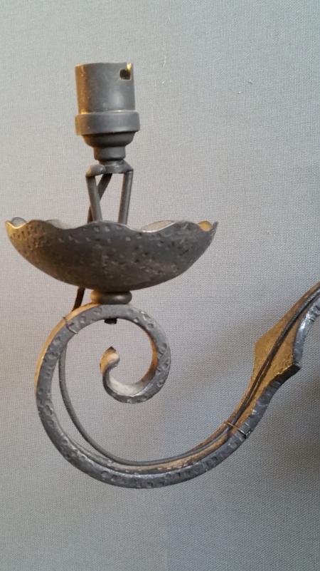 Pairs of wrought iron wall lights with coat of arms;