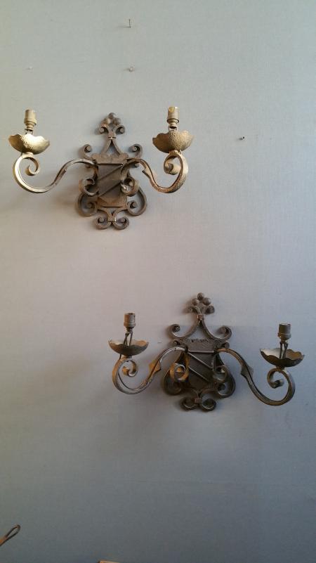 Pairs of wrought iron wall lights with coat of arms;